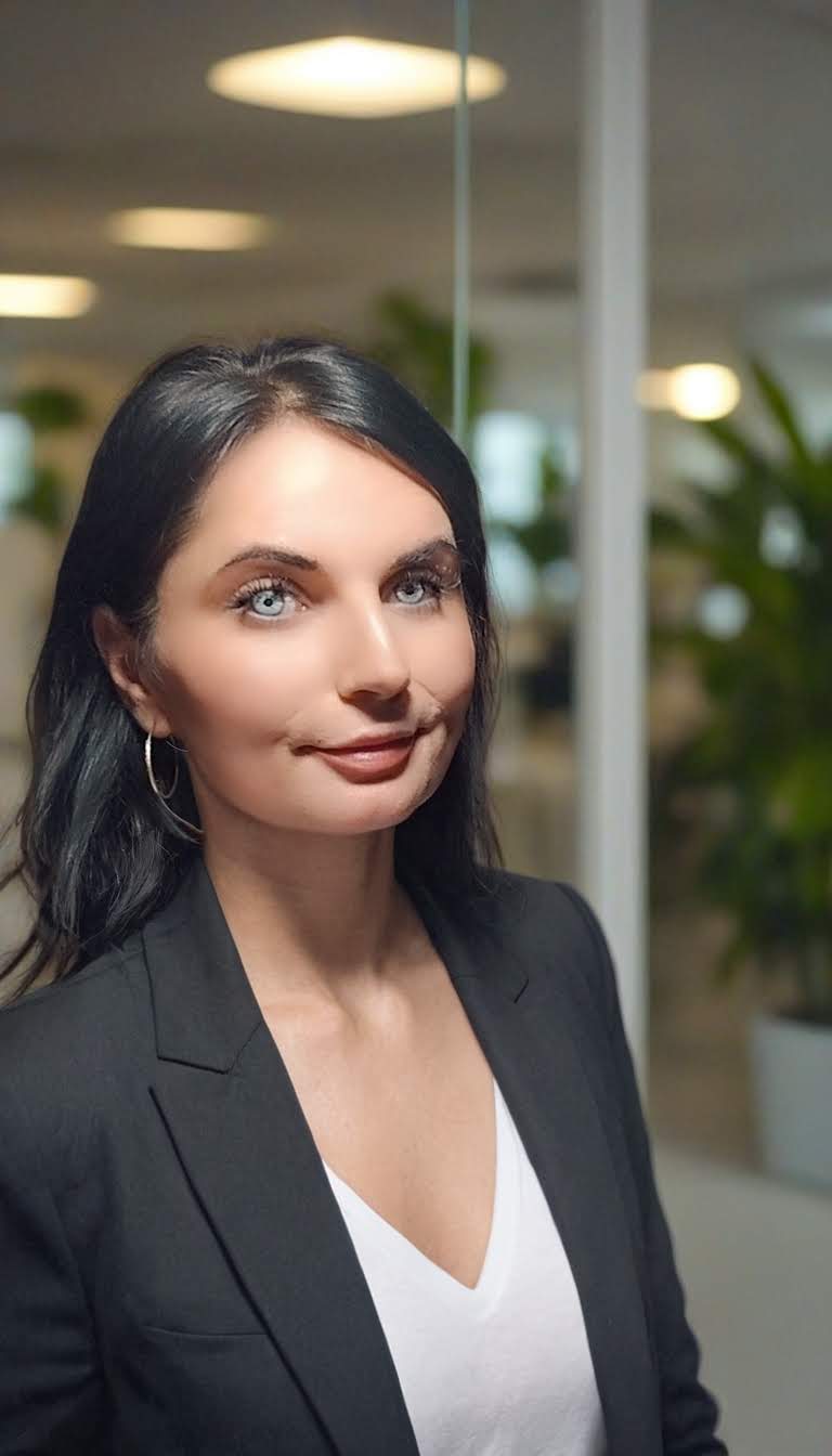 Jessica in a modern office, leading a discussion on AI Citation Optimization